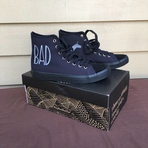 BRAND NEW.- Inkkas Black sneaker size 10W.